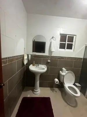 a bathroom with a toilet and a sink at Espacioso Casa en Puerto Plata cerca de La Playa 4 camas 3 baños Agua caliente Aire condicionado Wi-Fi in Puerto Plata