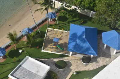 an overhead view of a small house with blue umbrellas at El Sueño, Breathtaking Ocean Front, Juan Dolio in Guayacanes