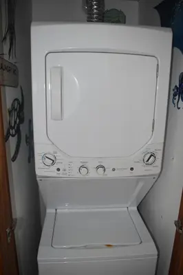 a white washer and dryer in a room at El Sueño, Breathtaking Ocean Front, Juan Dolio in Guayacanes