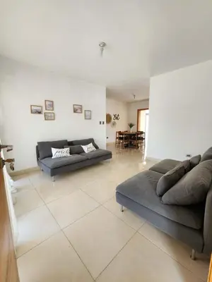 a large living room with two couches and a table at Cerro hermoso in Santiago de los Caballeros