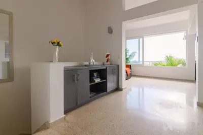 a kitchen with a sink and a cabinet in a room at Casa Mango- Relax - Pool Stunning Views in San Felipe de Puerto Plata