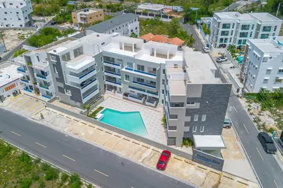 an aerial view of a building with a swimming pool at Coastal Comfort in Bayahibe 2BR 2BA Carribean Rose in San Rafael del Yuma
