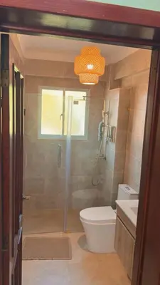 a bathroom with a shower and a toilet and a sink at Marvilla - Coastal Condo Poolside & Ocean View in Boca Chica