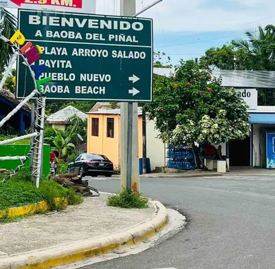 a street sign on the side of a road at Cheerfull 4 bedroom Villa with pool #VillaLioness in Nagua