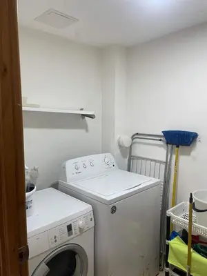 a laundry room with a washing machine and a washer at Luxury Penthhouse Frente Al Mar in Juan Dolio