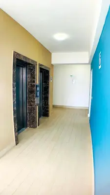 an empty room with two doors and a wooden floor at Apartamento en Boca Chica T2 707 in Boca Chica