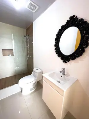 a bathroom with a toilet and a sink and a mirror at Apartamento en Boca Chica T2 707 in Boca Chica