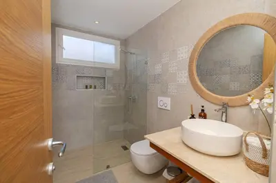 a bathroom with a sink and a shower and a mirror at Tropical 1BR Getaway in Dominicus Bayahibe - Garden Breeze