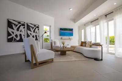 a living room with a couch and a table at Sosua Ocean Village Villa 24 in Sosúa
