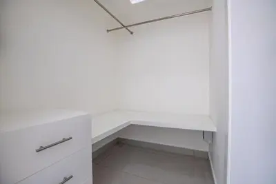 a white closet with a white shelf and a drawer at Sosua Ocean Village Villa 24 in Sosúa