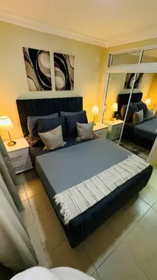 a bedroom with a large bed in a room at green oasis vacation retreat in La Grúa