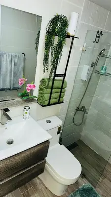 a bathroom with a toilet and a shower and a sink at green oasis vacation retreat in La Grúa