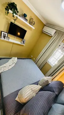 a small bedroom with a bed in a room at green oasis vacation retreat in La Grúa