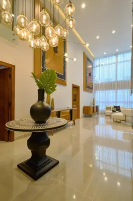 a lobby with a table with a vase on it at Acqualina’s View @ Santo Domingo in Santo Domingo