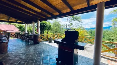 a grill on a patio with a view of the mountains at Luxury Villa Heated Pool, Firepit & Pool Table in Arroyo Frío