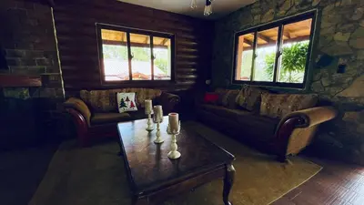 a living room with couches and a coffee table at Luxury Villa Heated Pool, Firepit & Pool Table in Arroyo Frío