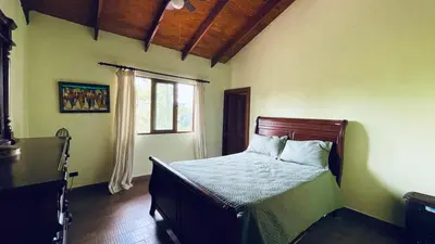 a bedroom with a bed in a room with a window at Luxury Villa Heated Pool, Firepit & Pool Table in Arroyo Frío