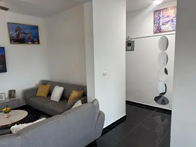 a living room with a couch and a table at Modern 3-Bedroom Apartment with Pool in Boca Chica