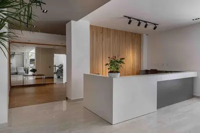a lobby with a reception counter with a potted plant at ®{LUX~City~Skyline} @DowntownSD PrivéJaccuziGym in Santo Domingo