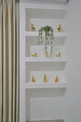 a white shelf with a potted plant on it at ®2BR{The~City~Center}@DTown PoolGym NearCecilip in Santo Domingo