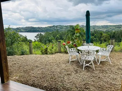 a table and chairs with a view of a lake at Villa ana in Colorado