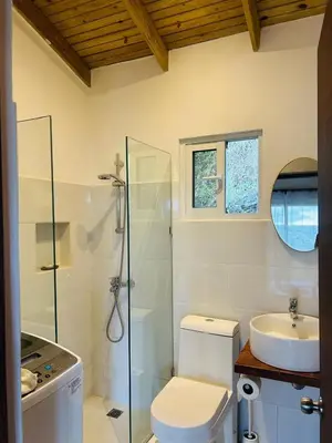 a bathroom with a shower and a toilet and a sink at Villa ana in Colorado