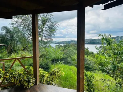 a view from the inside of a house looking out at a lake at Villa ana in Colorado