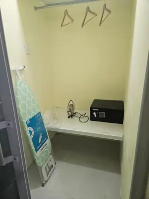 a room with a shelf with a toaster on it at Eastern Breeze in Hainamosa