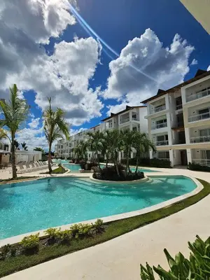 a swimming pool in front of some apartment buildings at Caribbean Comfort near the Sea l Cefiro 101 in La Laguna