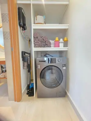 a washer and dryer in a laundry room with a wall at Caribbean Comfort near the Sea l Cefiro 101 in La Laguna