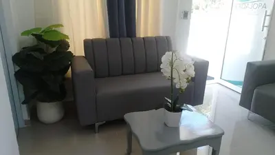 a living room with a couch and a table at Hotel en Pedernales in Pedernales