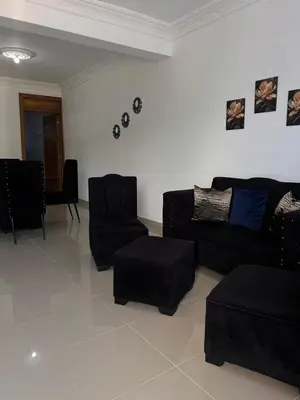 a living room with a black couch and chairs at Luxury Royalty-1 in Santa Cruz de Barahona