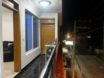 a room with a balcony with a door and a window at Luxury Royalty-1 in Santa Cruz de Barahona