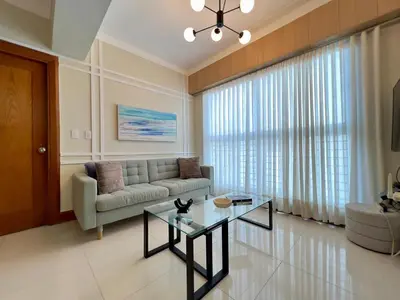 a living room with a couch and a table at Acogedor apartamento ÁGORA MALL in Colorado
