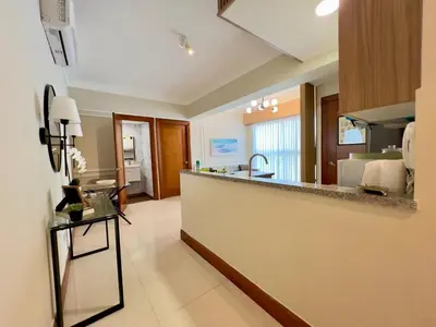 a large kitchen with a counter top in a room at Acogedor apartamento ÁGORA MALL in Colorado