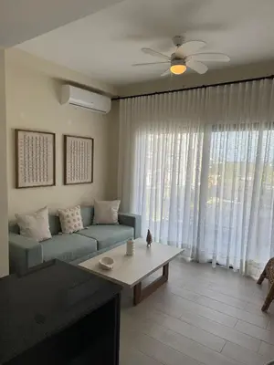 a living room with a couch and a coffee table at Hermoso PUNTA CANA VISTA CANA in Colorado