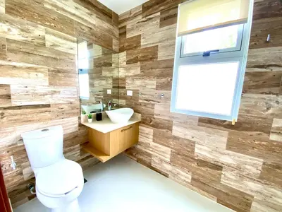 a bathroom with a toilet and a sink at Cocotal Beach Pool and Golf course Punta Cana RD in Colorado