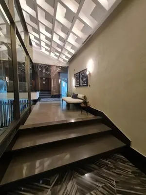 a lobby of a building with a pond in the floor at Exclusivo Apartamento de un Dormitorio in Santo Domingo