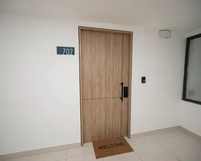 a door in a room with a welcome sign on it at Santiago s top Residence, Experience it & Believe it in Santiago de los Caballeros