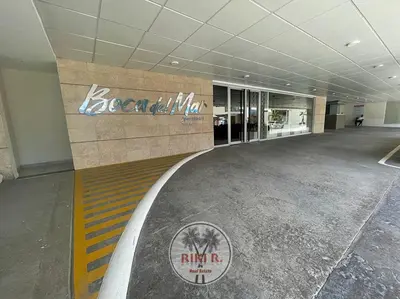 an empty lobby of a building with a sign on the wall at RIKI R Boca del Mar III Apartment 406 in Boca Chica