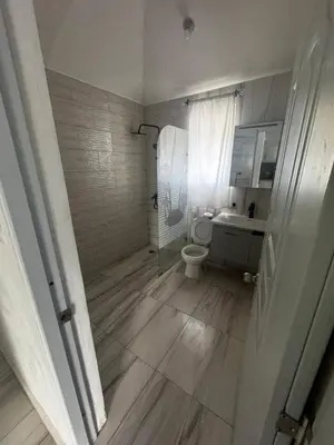 a bathroom with a shower and a toilet and a sink at El Legendario in Sosúa