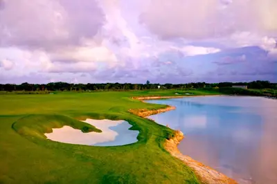 an aerial view of a golf course with a body of water at Vista Family Garden Suite Pool front 2 Bdrms in Punta Cana