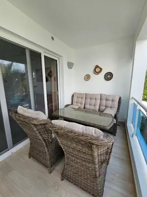 a patio with a couch and a table and chairs at Estrella Garden Condos Dominicus l Meridiana 204 in La Laguna