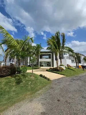 a house with palm trees and a driveway at Estrella Garden Condos Dominicus l Meridiana 204 in La Laguna