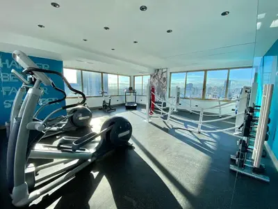 a gym with cardio equipment in a building at Upscale City Center Condo Pool in Santo Domingo