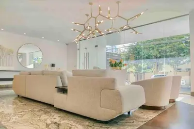 a living room with a couch and chairs and a chandelier at Upscale City Center Condo Pool in Santo Domingo