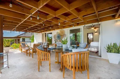 a living room with a table and chairs at Villa Polo Luxury Villa in Casa de Campo, La Romana in La Romana