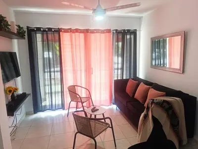 a living room with a couch and chairs and windows at Apartamento palmera del este 3 in La Javilla