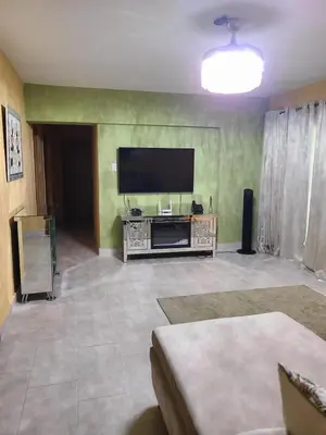 a living room with a large flat screen tv at Apartment5Start in Santo Domingo