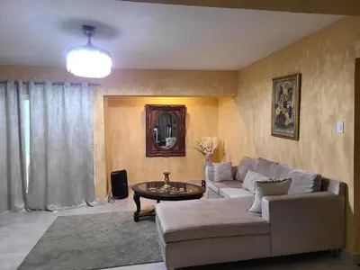 a living room with a couch and a table at Apartment5Start in Santo Domingo